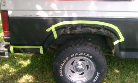 1985 Ford Bronco - Preparing the rear fender of a 1985 Ford Bronco for rust repair.