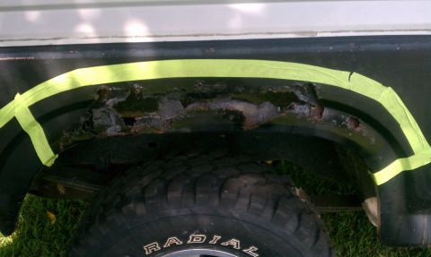 1985 Ford Bronco - The fender trim on this vehicle is severely rusted and has been taped off.