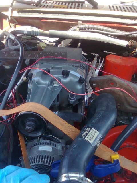 1984 Ford Bronco - Orange strap makes a good belt length checker.
