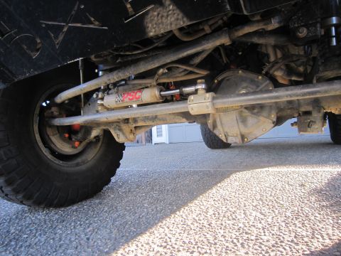 2008 Jeep Wrangler - Undercarriage view of a Jeep Wrangler, showing steering components and differential.