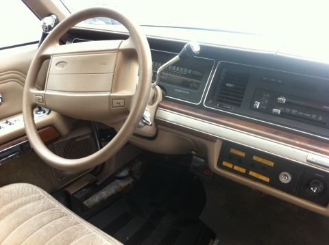 1991 Ford Crown Victoria LTD - Interior view of a 1991 Ford Crown Victoria LTD, showing the dashboard, steering wheel, and seating.
