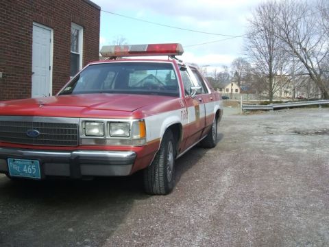 1991 Ford Crown Victoria LTD - This Ford Crown Victoria, likely from the late 1980s, is equipped as a fire department vehicle.