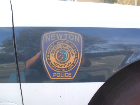 1991 Ford Crown Victoria LTD - The side of a police vehicle displays the official seal of Newton, Massachusetts.