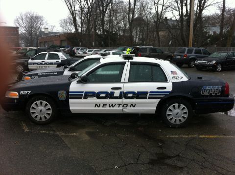 1991 Ford Crown Victoria LTD - Newton Police car parked in a lot with other vehicles visible.