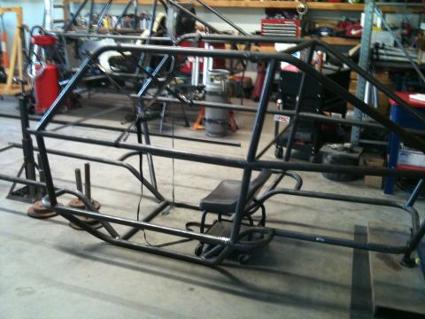 1966 Ford Bronco - This is the frame of a custom-built vehicle, likely for racing, in a workshop.
