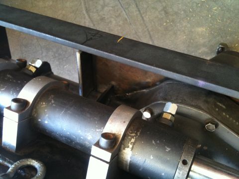 1966 Ford Bronco - Close-up of an automotive differential housing with a welded metal bracket attached.