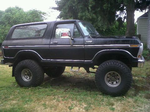 1979 Ford Bronco - Side profile of a modified 1978 Ford Bronco with large off-road tires and a raised suspension.