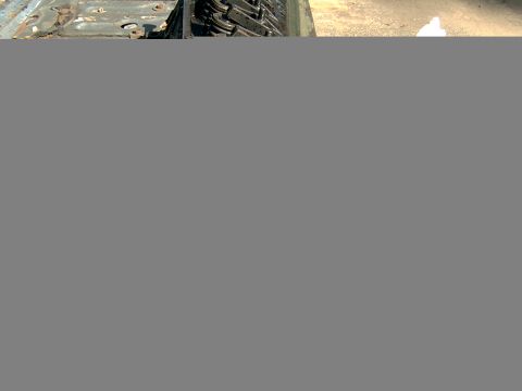 1982 Ford Bronco - Close-up view of an engine block and tire, with the SUPERMOTORS.NET watermark visible.
