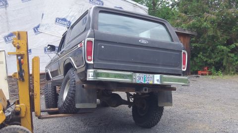 1979 Ford Bronco - Black 1978 Ford Bronco rear view, lifted by a forklift. Oregon plate SKY 207.