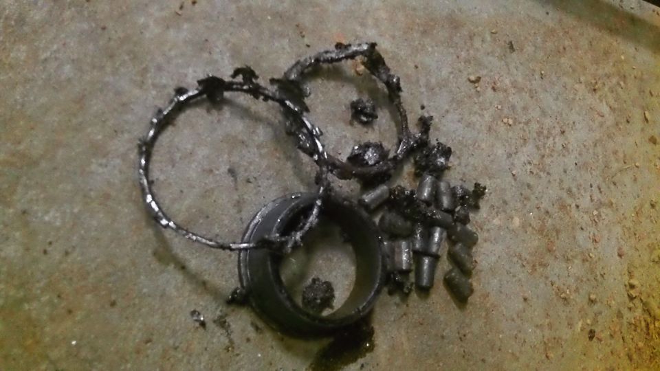 Broken bearing parts on concrete floor