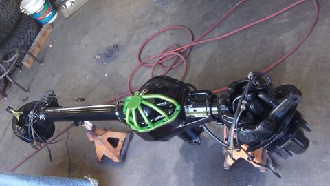1979 Ford Bronco - Ford rear axle assembly, likely for a truck or SUV, with a green differential cover.