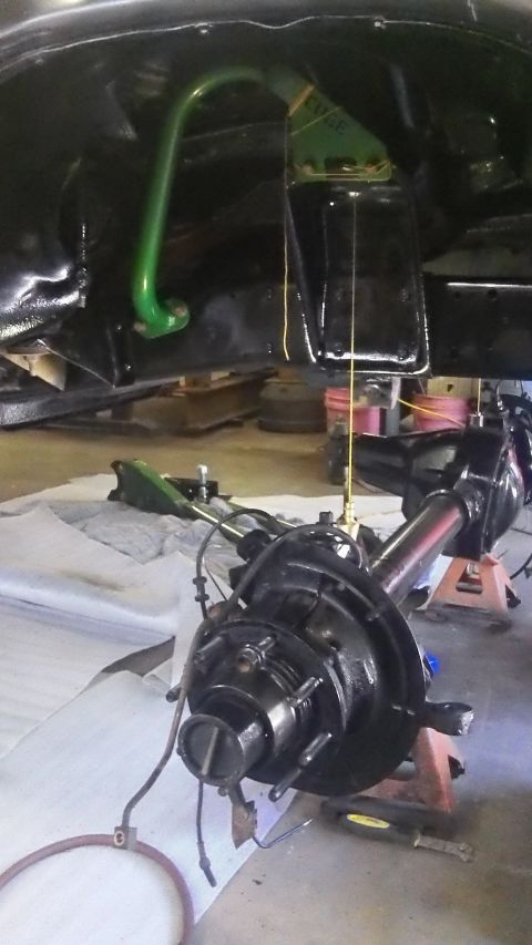 1979 Ford Bronco - Close-up view of suspension components and differential assembly, likely during a repair or modification.