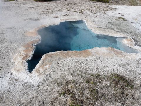 2006 Ford E350 - A natural hot spring with vibrant blue water and mineral formations.