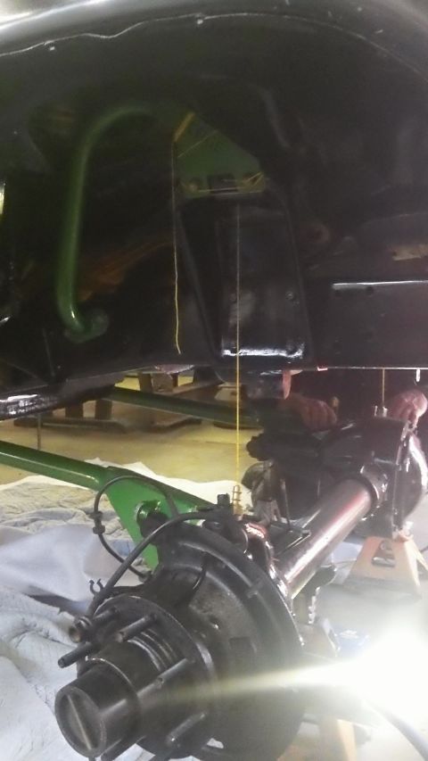 1979 Ford Bronco - Close-up of vehicle axle and suspension parts, suggesting a repair or upgrade is in progress.