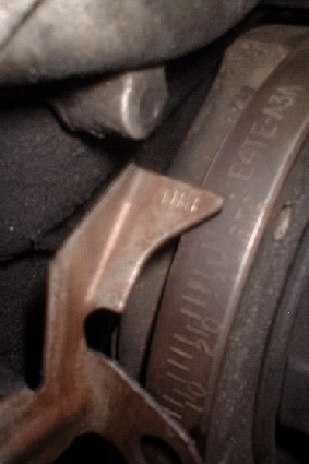 1993 Ford Bronco - Close-up of an engine part showing stamped identification numbers and text.
