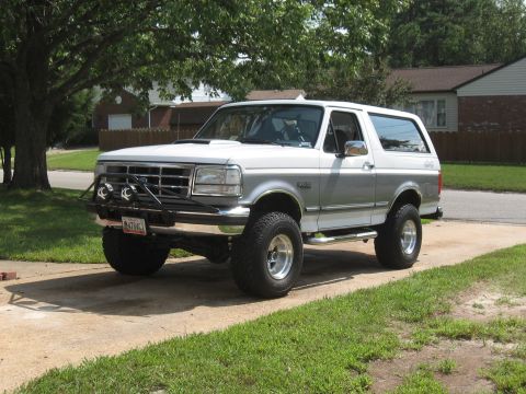 1994 Ford Bronco - This Ford Bronco features a two-tone paint scheme and off-road modifications.