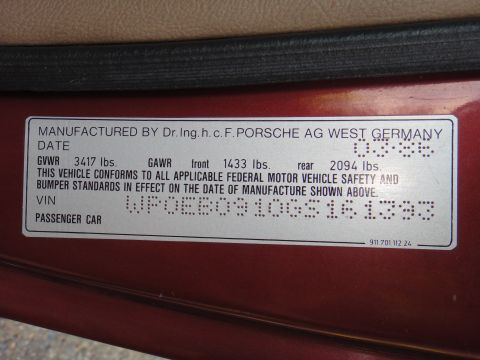 1986 Porsche 911 - This door jamb sticker shows the VIN and manufacturing details for a 1986 Porsche 911.