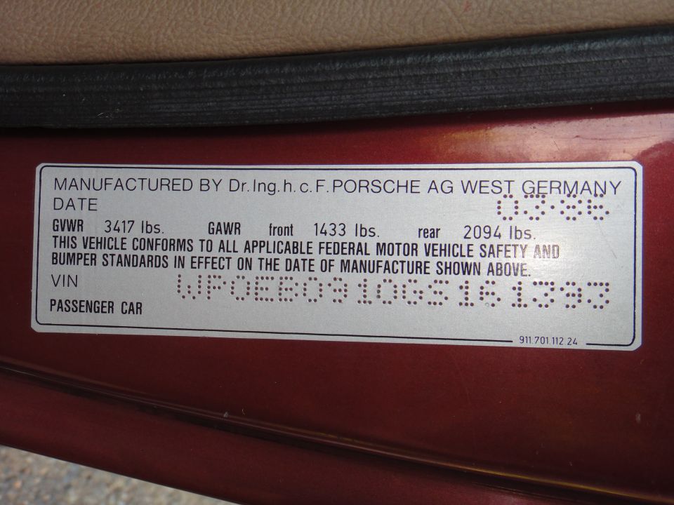 Door jamb sticker with VIN and manufacturing date for a 1986 Porsche 911