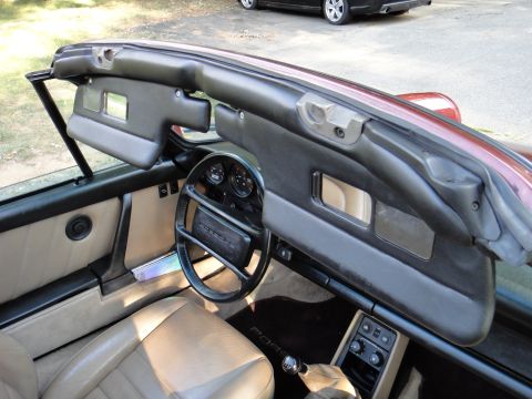 1986 Porsche 911 - Interior view of a 1986 Porsche 911, tan leather seats and the iconic steering wheel.