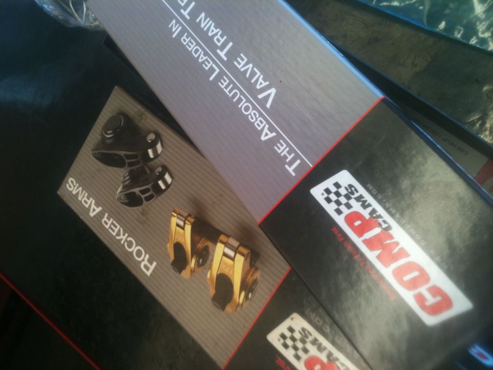 Boxes of COMP Cams rocker arms and valve train parts