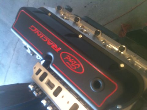 1993 Ford Bronco - Close-up of a black Ford Racing valve cover with red accents and lettering.