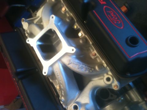 1993 Ford Bronco - Close-up of a Ford engine's intake manifold and valve cover, showing the Edelbrock branding on the manifold.