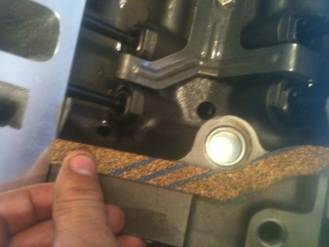 1993 Ford Bronco - Close-up of an engine gasket being fitted into place.
