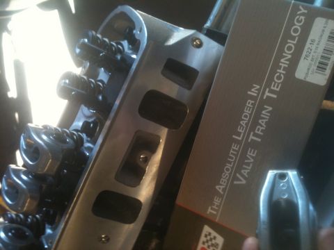 1993 Ford Bronco - Close-up of an engine cylinder head and a box for valve train components.