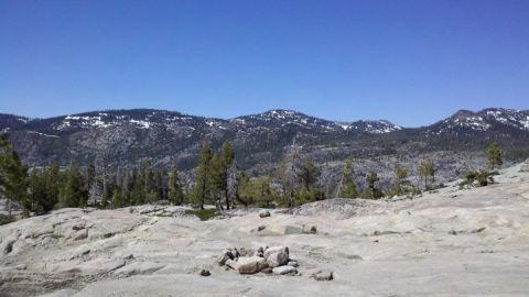 1971 Ford Bronco - A scenic view of a mountainous region with a clear sky and sparse vegetation.