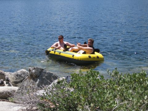 1971 Ford Bronco - Two men enjoy a sunny day on the water in an inflatable boat.
