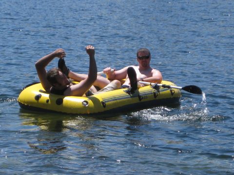 1971 Ford Bronco - Two men enjoy a day on the water in an inflatable raft.