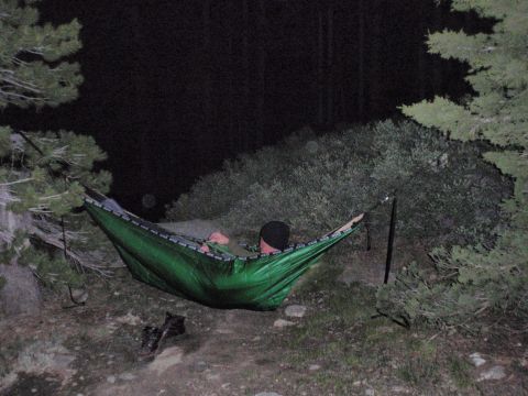 1971 Ford Bronco - Nighttime camping scene with a person in a hammock, a Supermotors watermark.