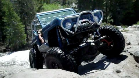 1971 Ford Bronco - This heavily modified 1971 Ford Bronco is tackling a rocky trail.