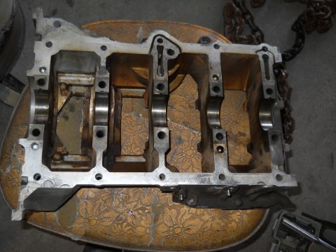 2006 Ford E350 - A disassembled engine block is shown, revealing its internal structure and bearing supports.