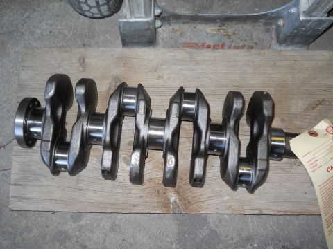 2006 Ford E350 - A crankshaft is shown with a tag attached, indicating it is a vehicle part.