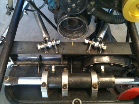 1966 Ford Bronco - Close-up view of custom buggy construction, focusing on the engine and suspension.