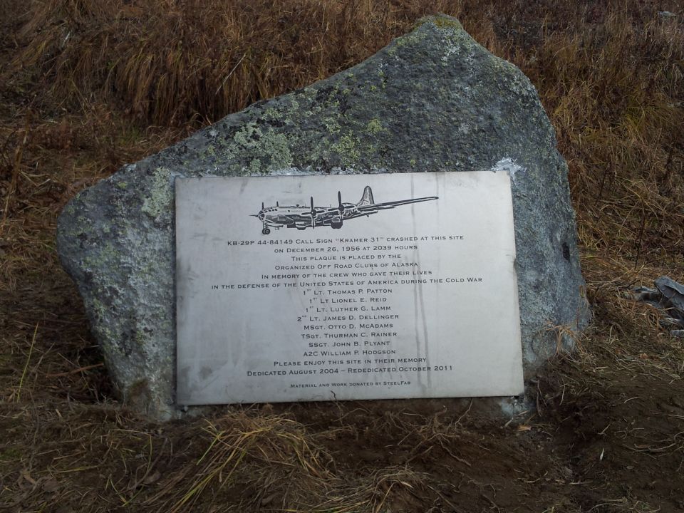 Memorial plaque with airplane illustration and text about a crashed KB-29 bomber
