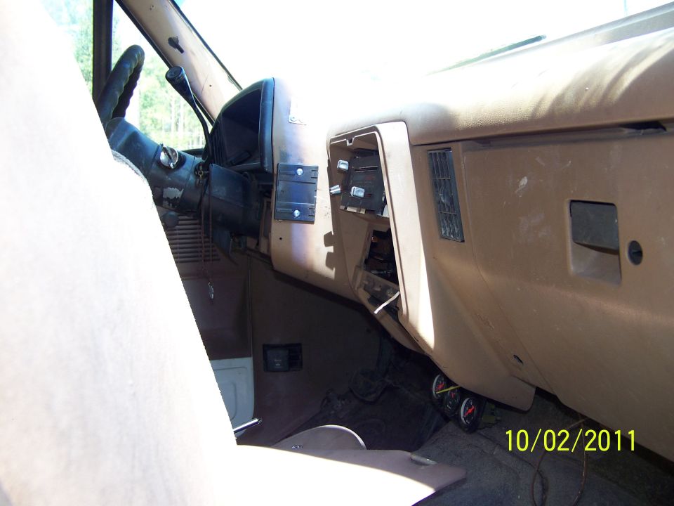 1989 Ford Bronco interior showing dashboard, steering wheel, and passenger seat