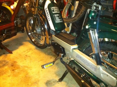 1981 Garelli Rally Sport - A green Garelli Gran Sport moped is parked indoors next to another vehicle.