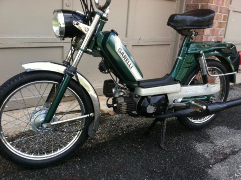 1981 Garelli Rally Sport - This green moped features chrome fenders and 'Garelli' branding on its fuel tank.