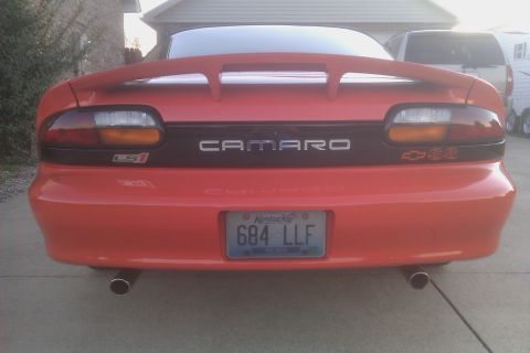 1999 Chevrolet Camaro - Rear view of a red 1999 Chevrolet Camaro showing the 'Camaro' and 'SS' badging.