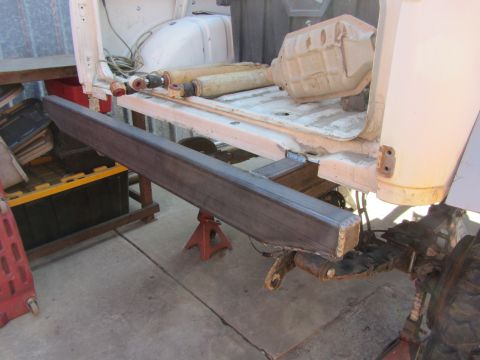 1987 Suzuki Samurai - Custom rear bumper fabrication in progress, vehicle supported by jack stands.