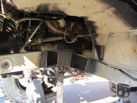 1987 Suzuki Samurai - Underbody view of a vehicle's frame and suspension system, showing modifications.
