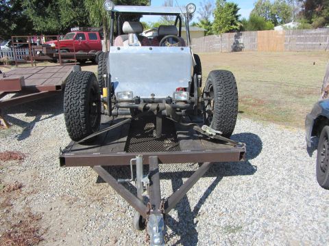 1987 Suzuki Samurai - This off-road vehicle is on a trailer, with another vehicle partially visible to the right.