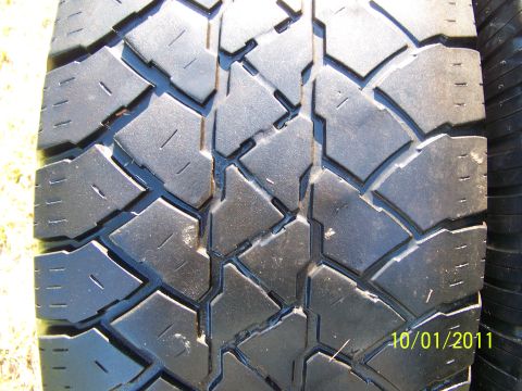 1986 Ford Bronco - Close-up of a tire tread pattern, with a date stamp visible in the lower right corner.