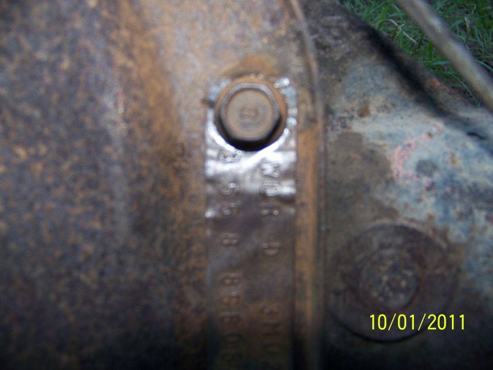 Differential housing with stamped numbers and a bolt