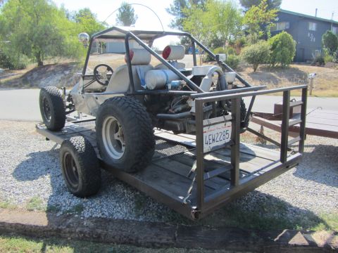 1987 Suzuki Samurai - A custom dune buggy is loaded onto a trailer, viewed from the rear.