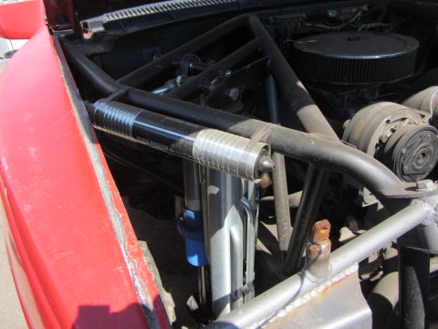 1987 Suzuki Samurai - Custom roll cage and suspension components are visible in the engine bay of this modified vehicle.