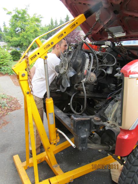 1984 Ford Bronco - Engine removal in progress with a yellow engine hoist. Date 10/02/2011.