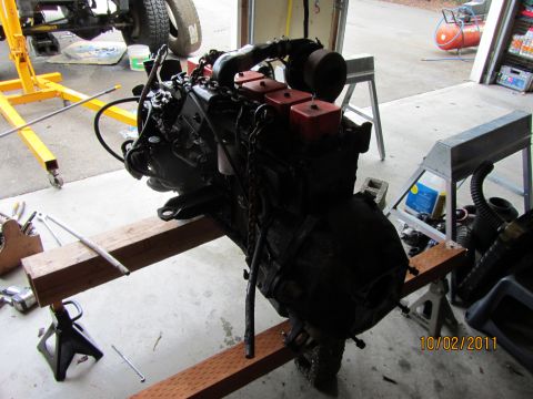 1984 Ford Bronco - Engine removed from vehicle and placed on sawhorses for repair or modification.